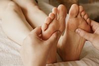 closeup-shot-masseur-massaging-female-s-feet